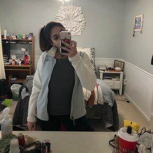 white and grey north face zip up sweater